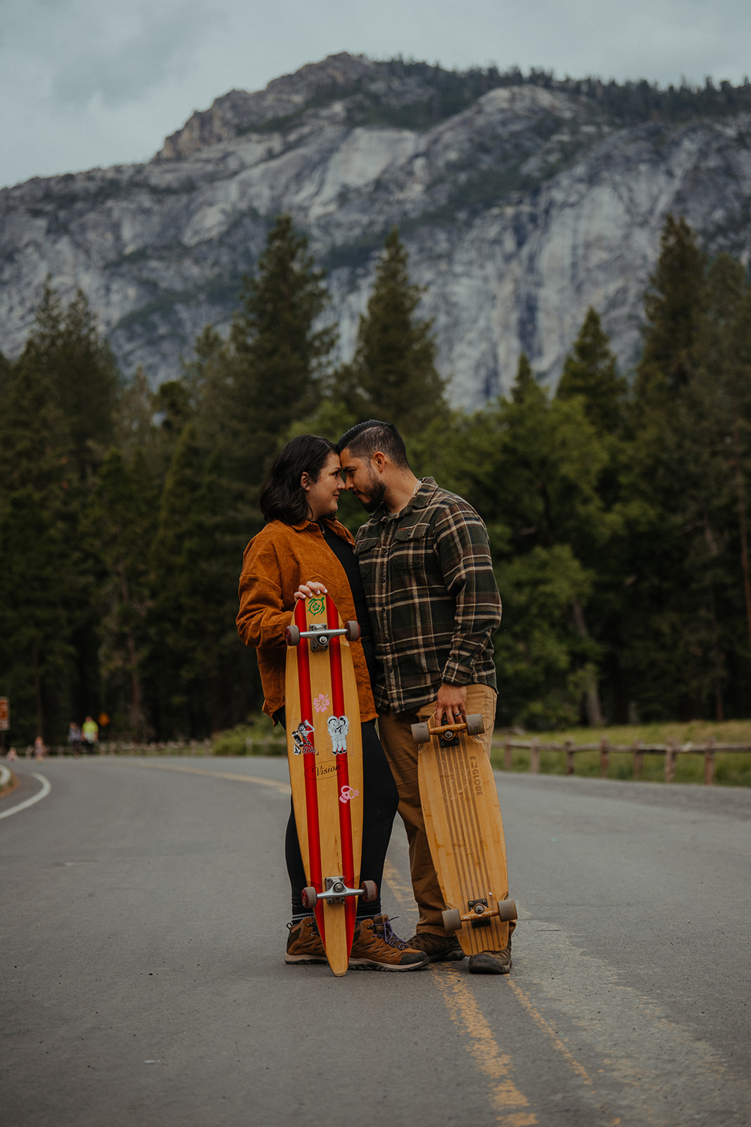 Couple long boards side-by-side through Yosemite Valley.