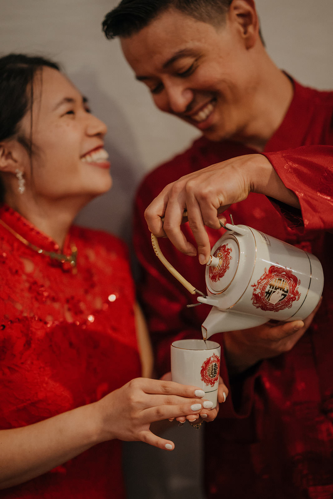 Bride and groom enjoying tea at Chinese tea ceremony