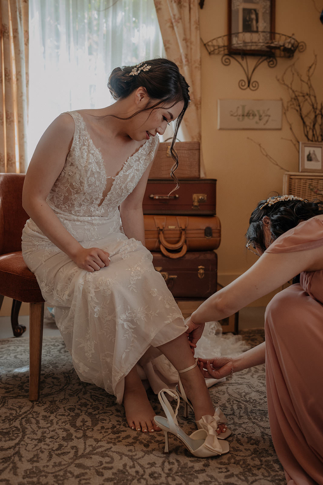 Bride putting on shoes in the brides cottage at the homestead in oak glen california