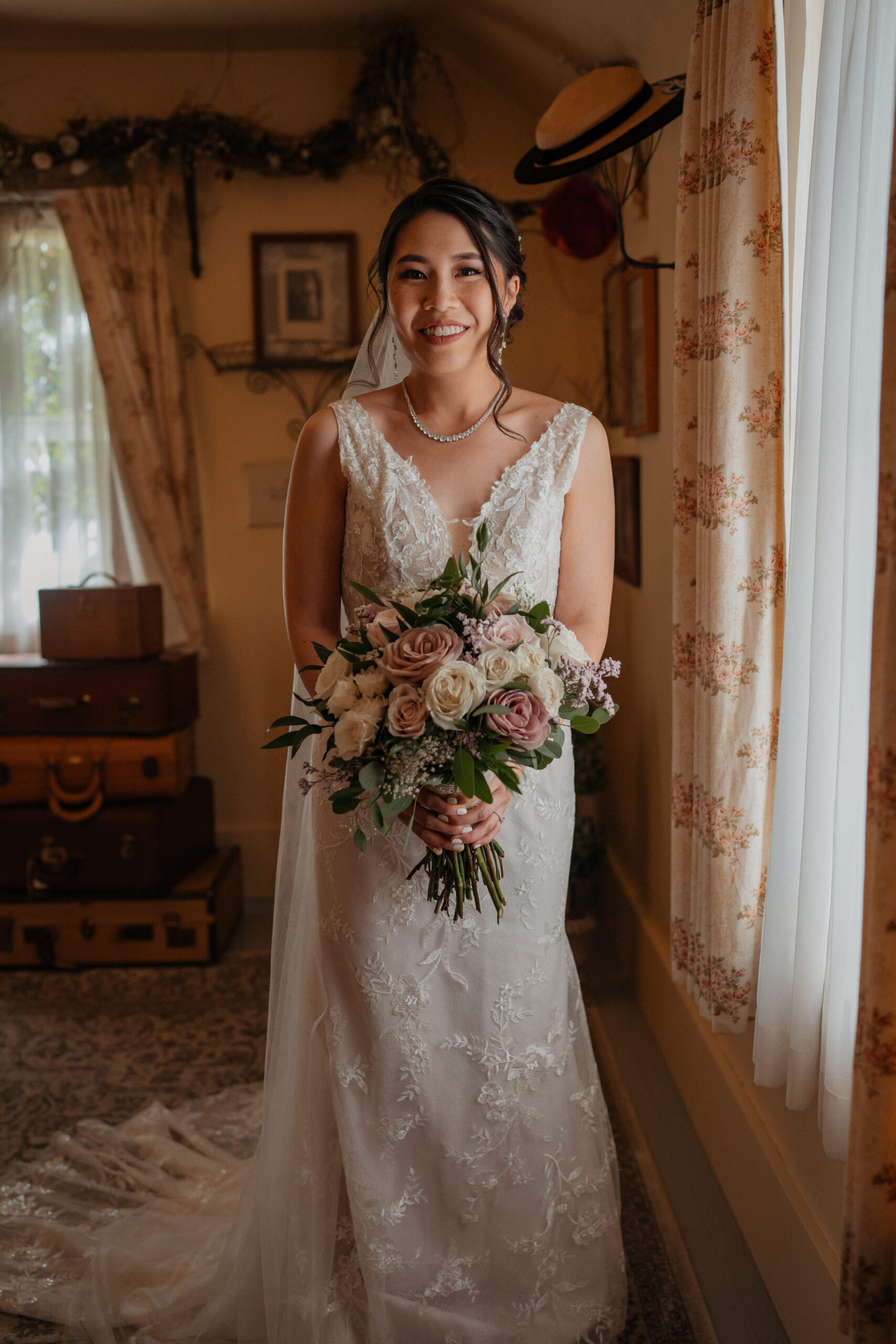 Bridal portrait with bouquet at the homestead in oak glen