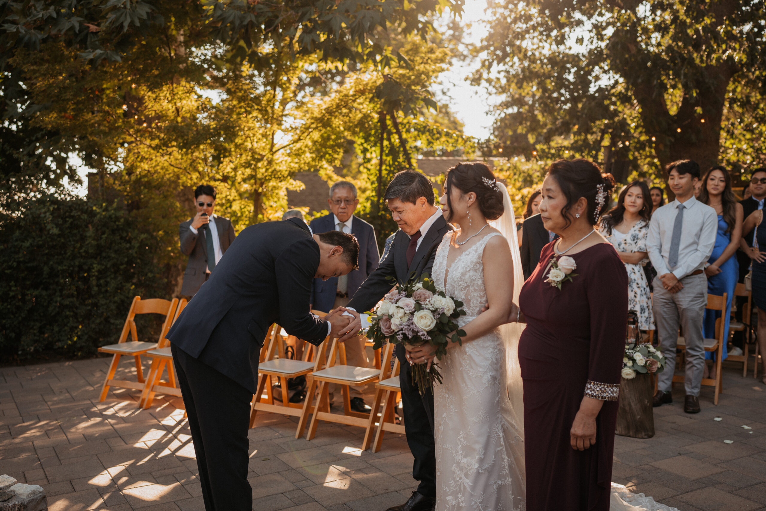 Groom greeting bride at ceremony at the homestead.