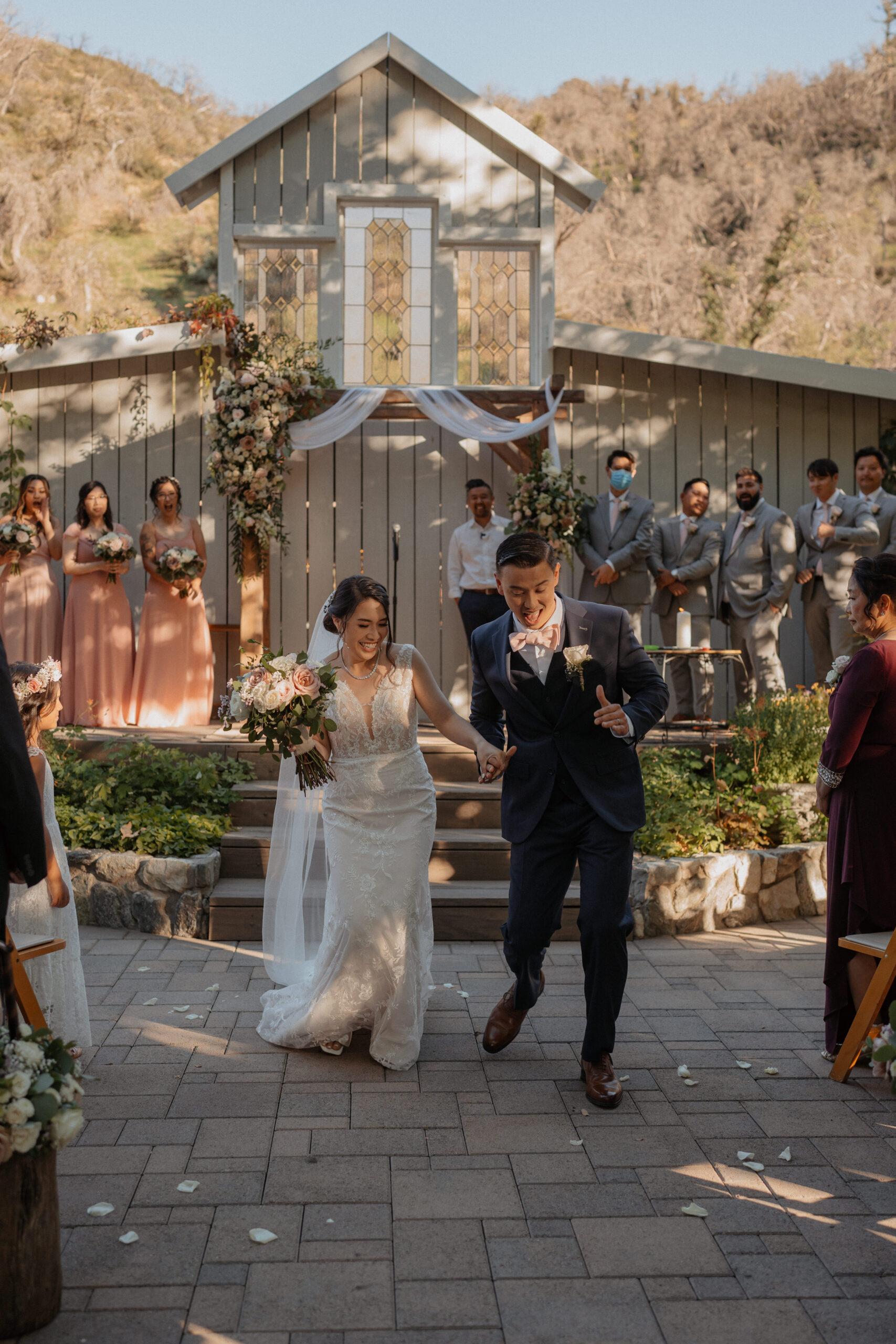 Bride and Groom Dancing down aisle after ceremony at the homestead in oak glen.