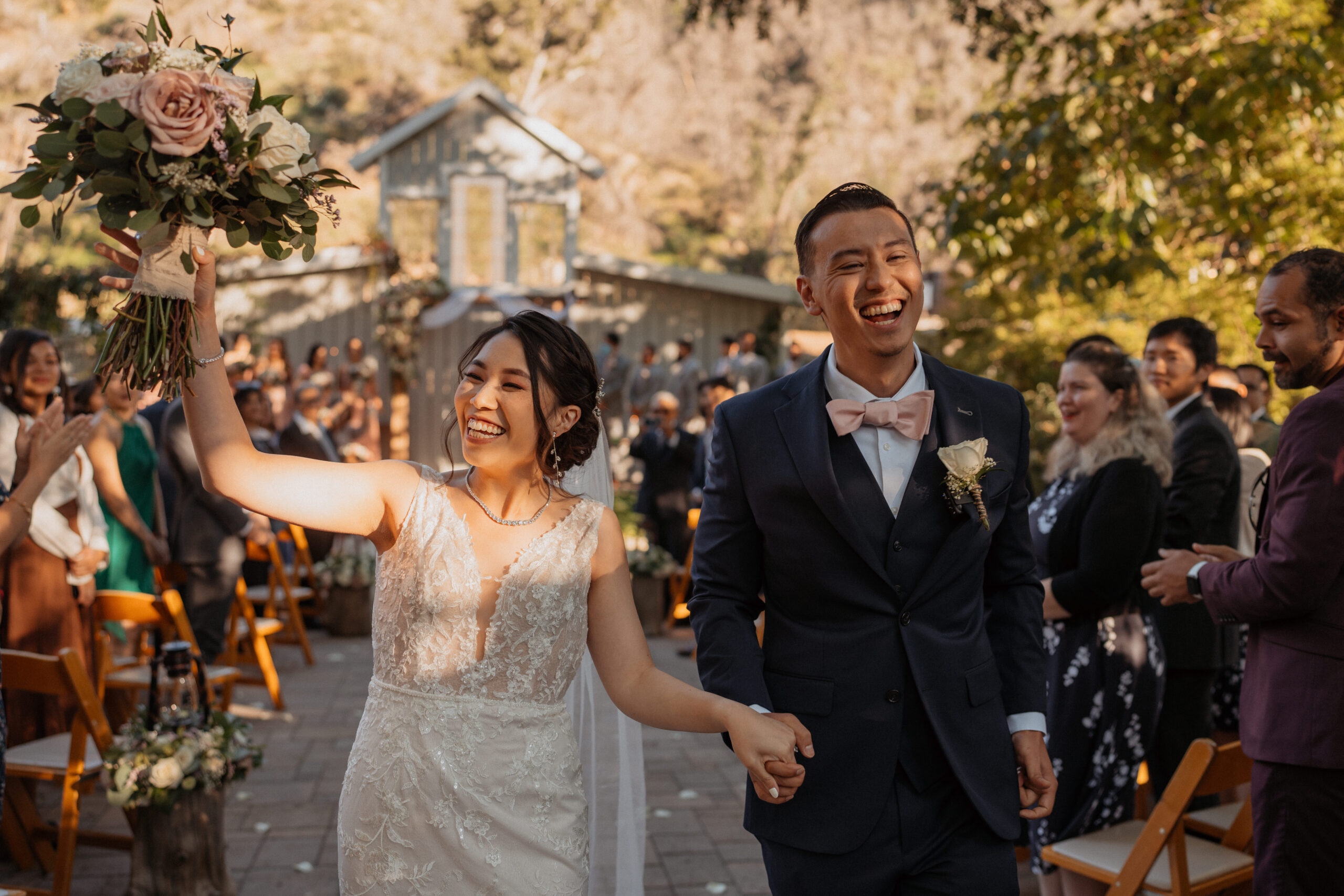 Bride and groom exiting ceremony at the homestead in oak glen.