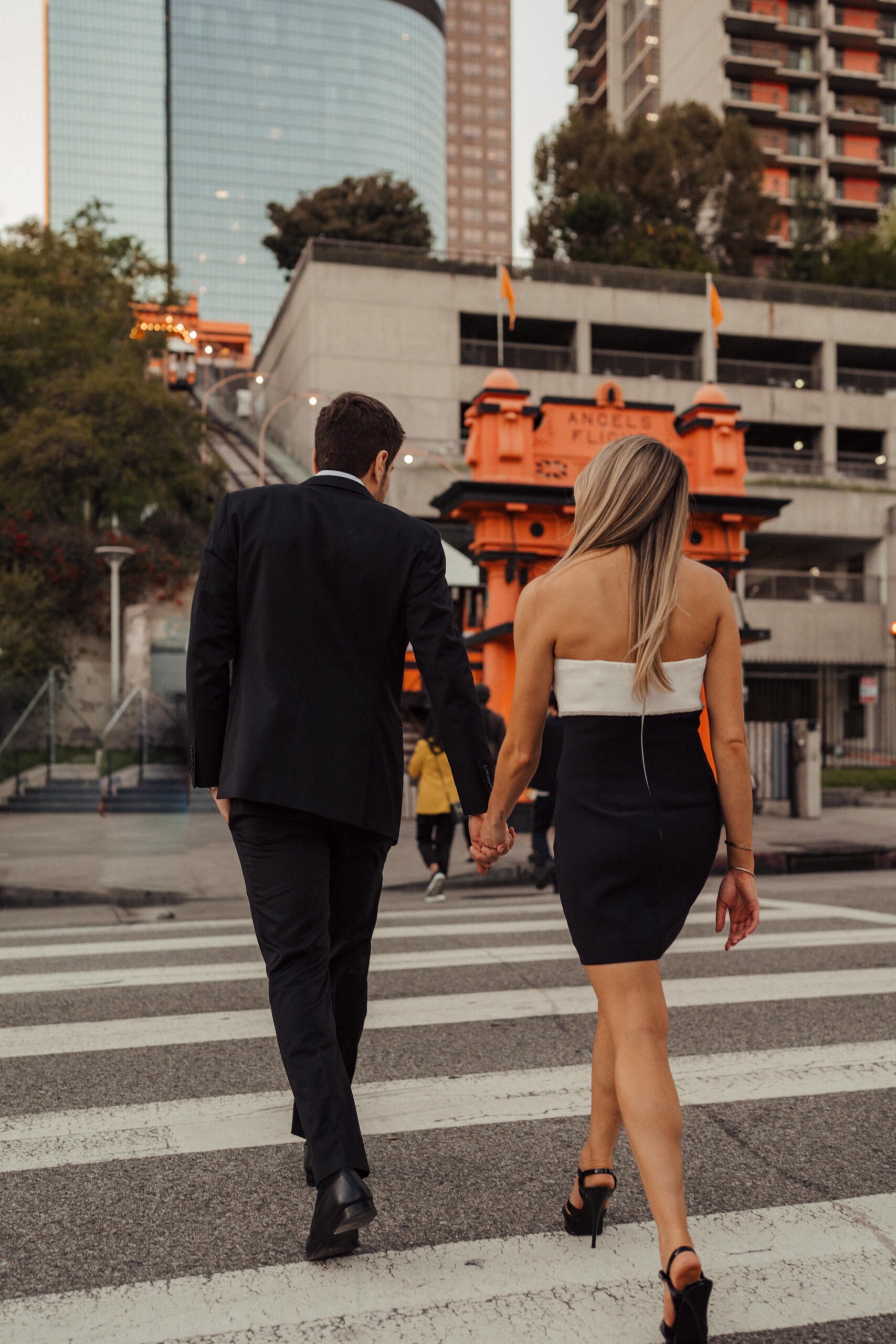 Engaged couple takes engagement photos in front of Angels Flight in Downtown Los Angeles