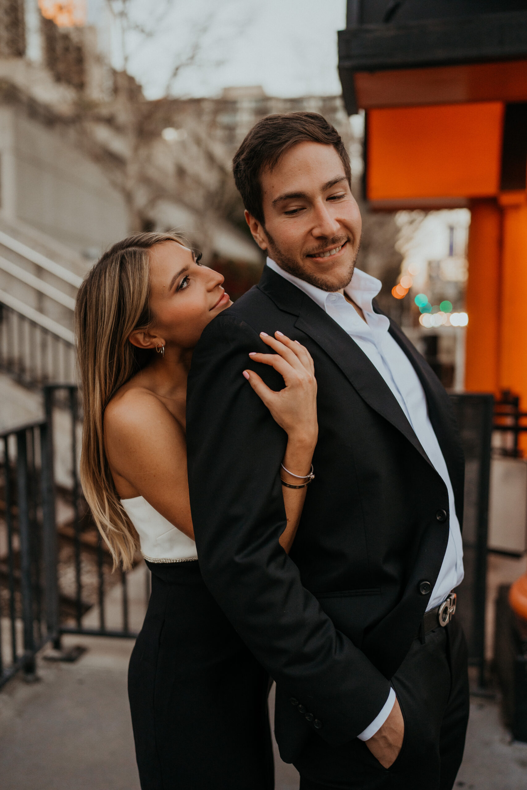 Engaged couple takes engagement photos in front of Angels Flight in Downtown Los Angeles