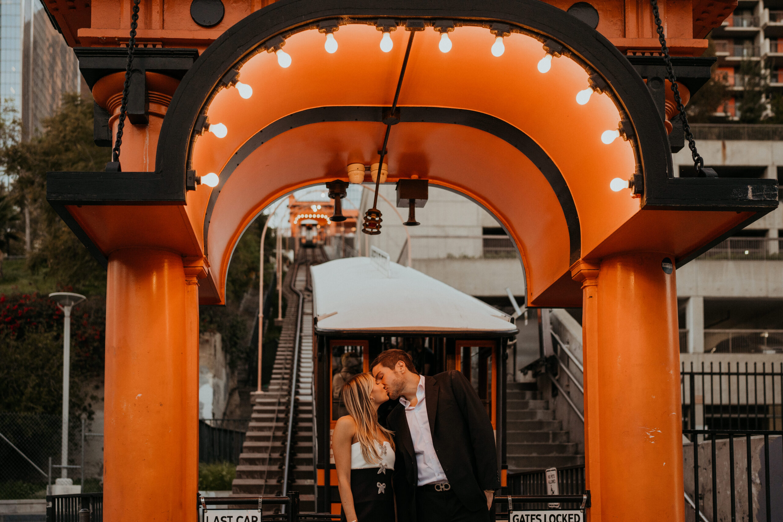 Engagement photos in front of Angel's Flight across the street from Grand Central Market
