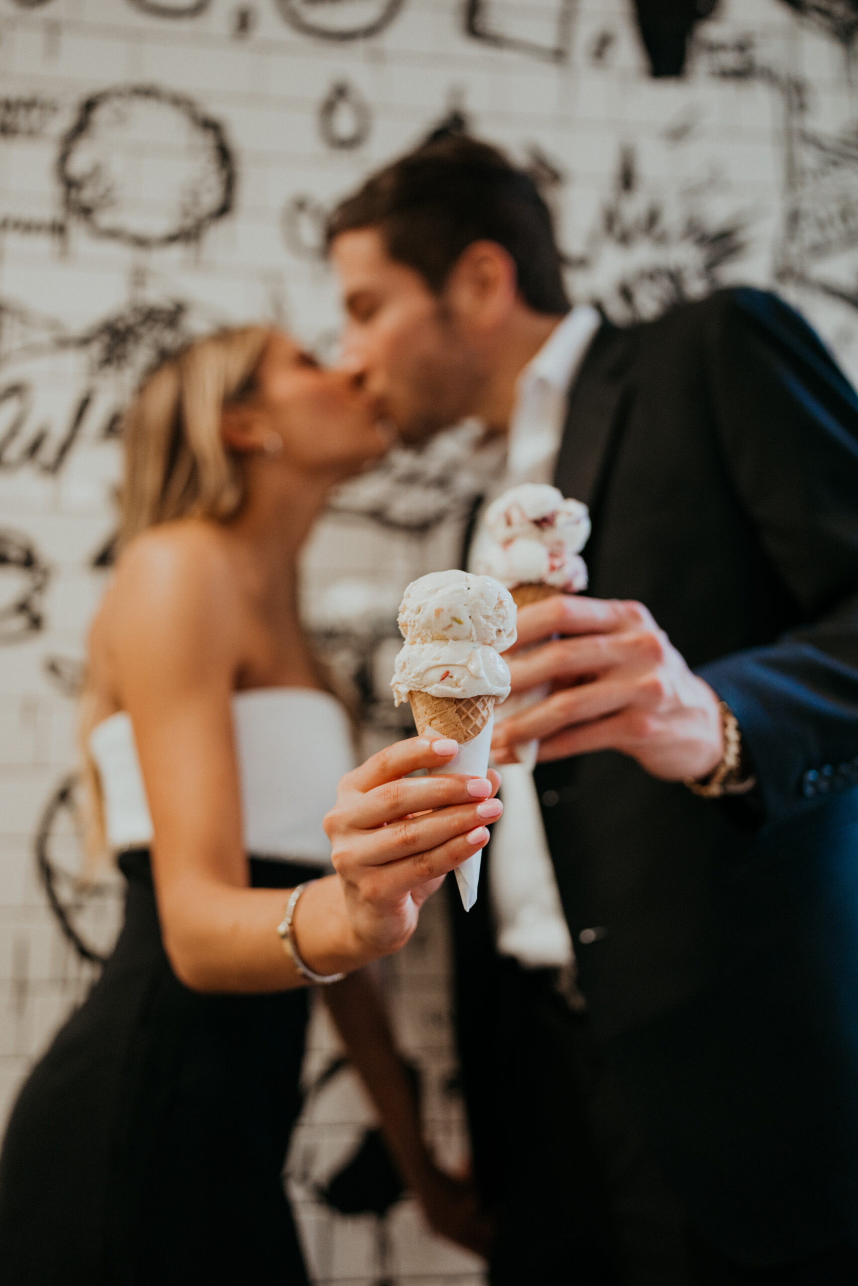 Engaged couple eats an ice cream cone together for their engagement photos at Grand Central Market in Downtown LA