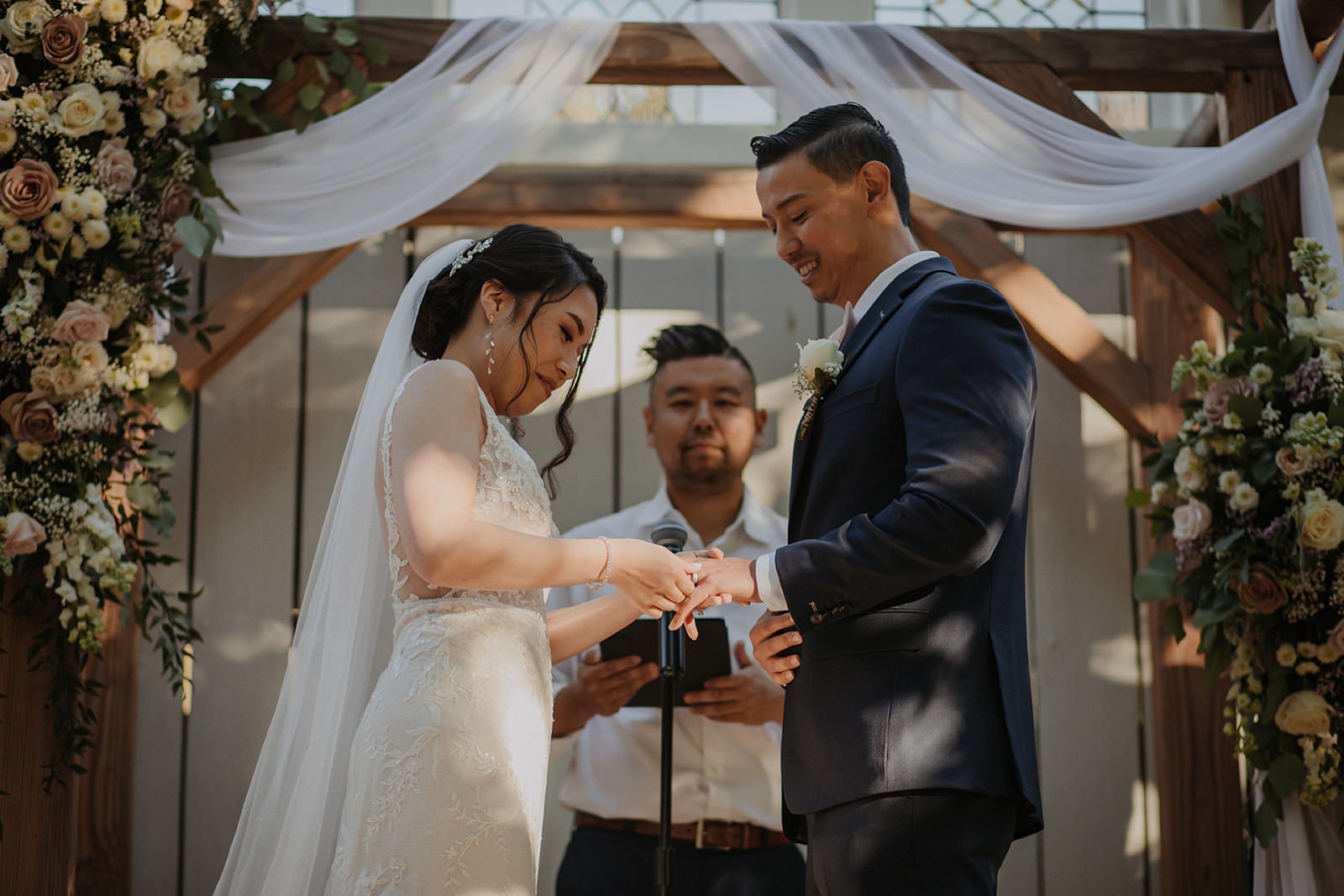 Bride and Groom exchanging rings at the homestead in oak glen.