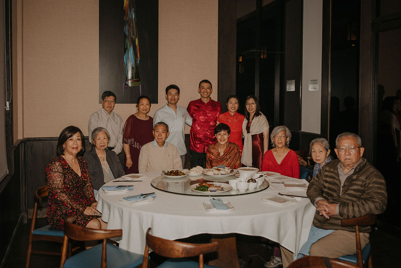 Bride and grooms family at tea ceremony dinner.