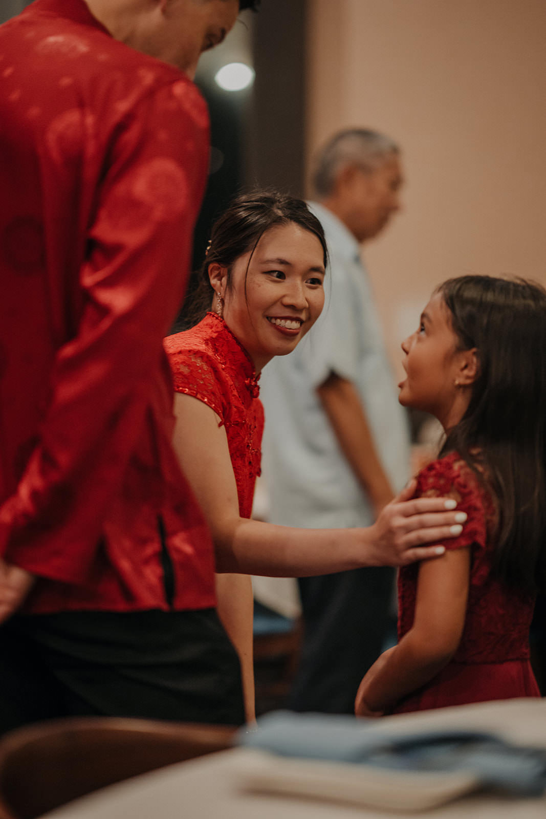 Bride greeting family at Chinese tea ceremony