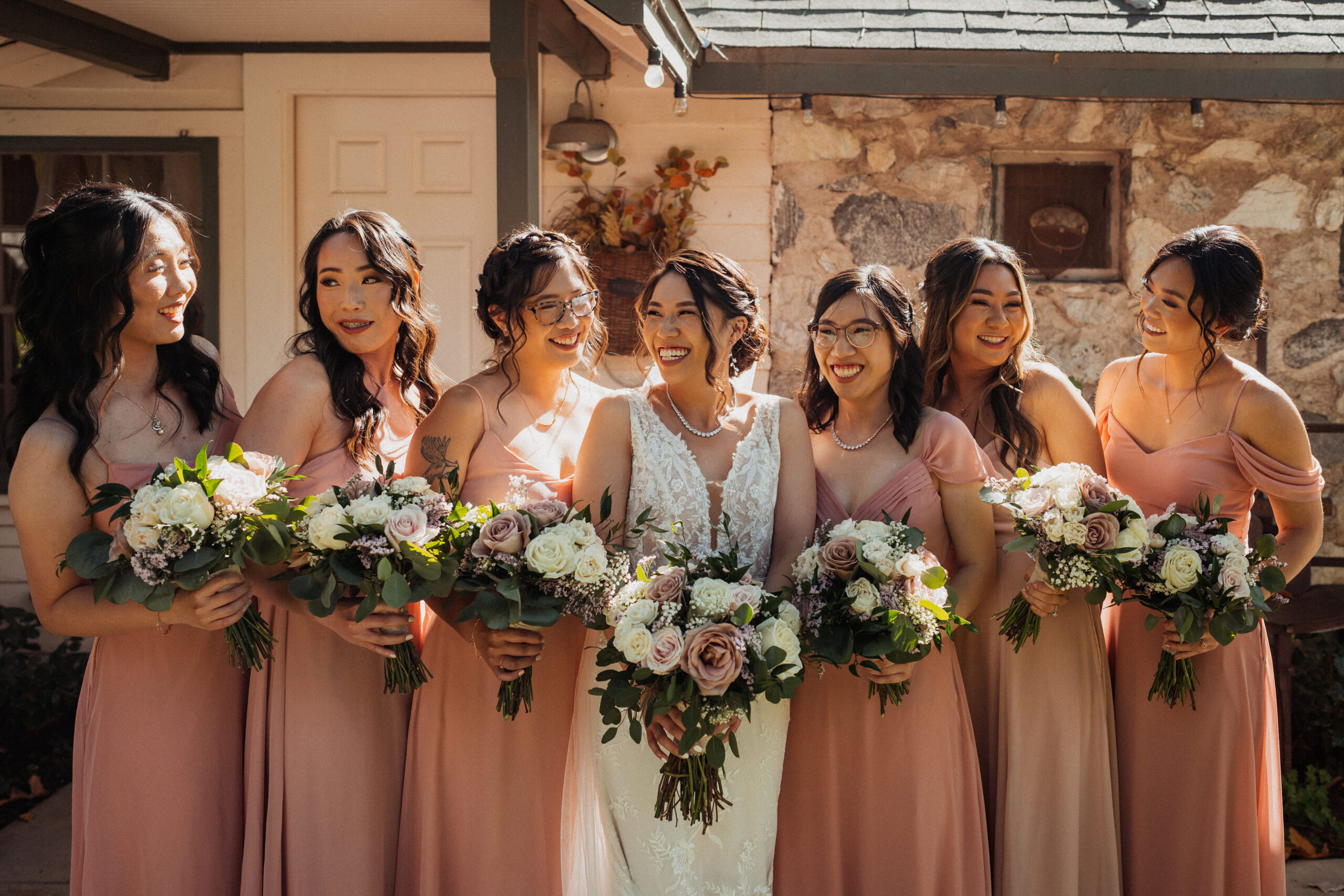 Bridesmaids smiling before together before wedding at the homestead.