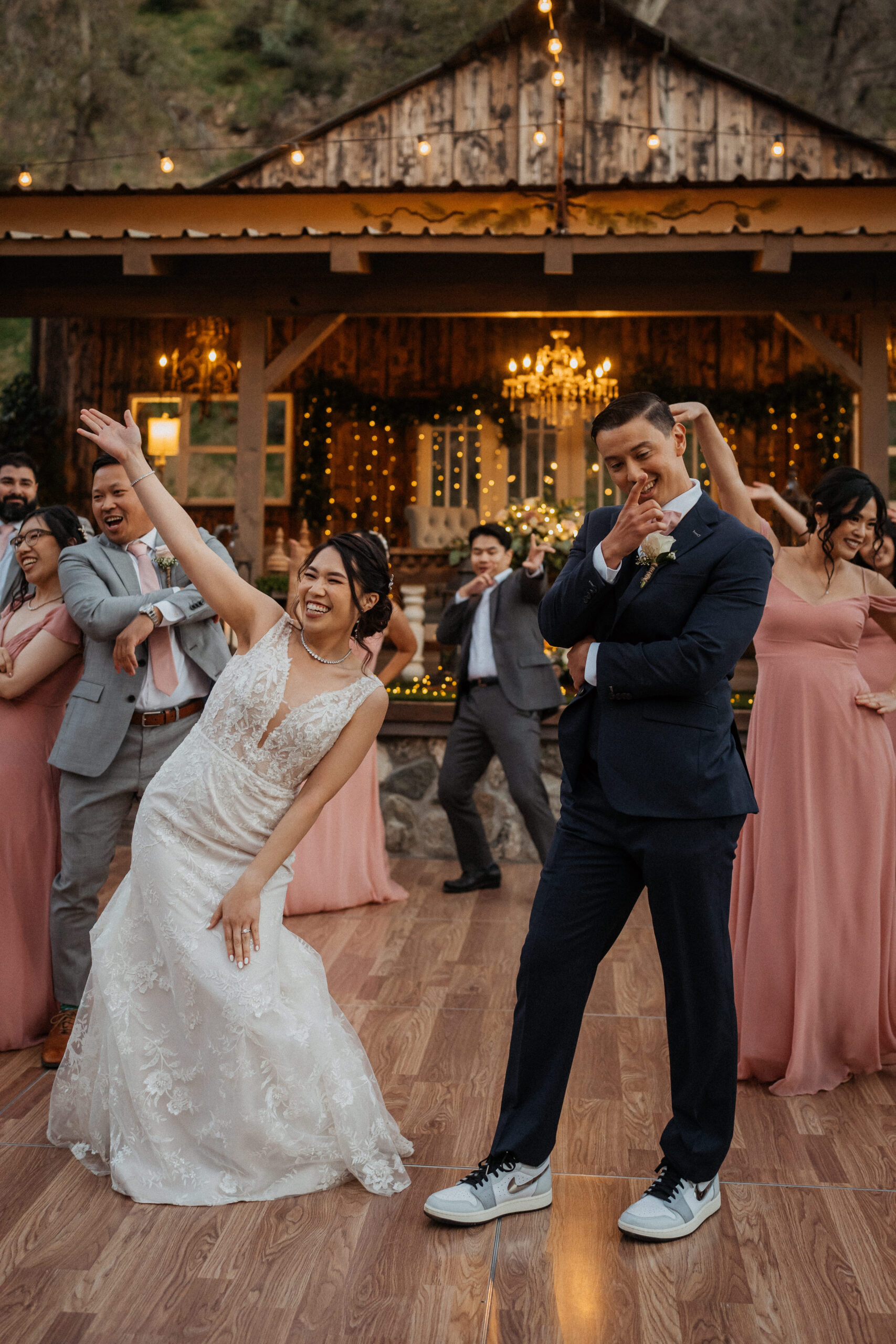 Bride and groom dance with their wedding party at the homestead in oak glen.